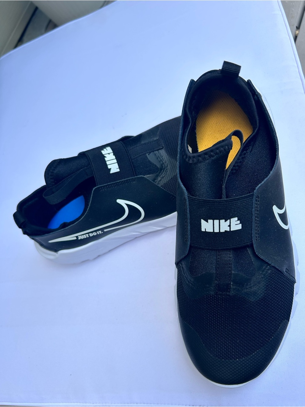 Nike Black Slip-On Sneakers with White Swoosh